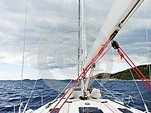 Voyage on yacht in Adriatic sea over rainy clouds