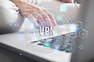 VPN, Virtual private network. Internet connection privacy concept. Modern laptop and user hand close-up view photo