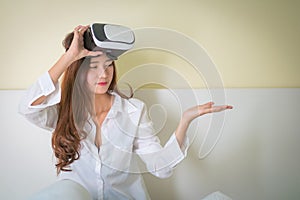 Vr box, Asian Woman looking though VR device