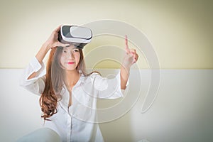 Vr box, Asian Woman looking though VR device