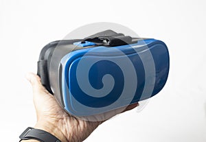 A VR supporting device resting upon a hand against a white background