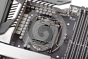 VRM zone Voltage regulator module, CPU socket with protector cap and memory sockets on modern motherboard