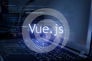 Vue.js inscription against laptop and code background. Learn vue programming language  computer courses  training
