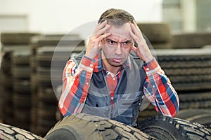 vulcanizing shop worker with headache