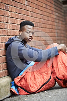 Vulnerable Teenage Boy Sleeping On The Street