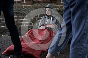 Vulnerable Teenage Boy Sleeping On The Street photo