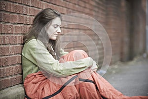 Vulnerable Teenage Girl Sleeping On The Street photo
