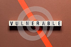 Vulnerable word concept on cubes photo