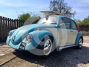 VW Beetle with surfboard