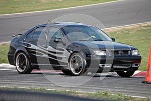 VW Jetta driving on Race Course