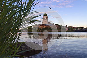 Vyborg Castle on a colorful sunset sky