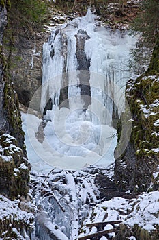 Vysny waterfall in winter in Falcon valley, Slovak Paradise National park, Slovakia