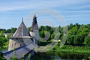 `Vysokaya` and `Ploskaya` towers of Pskov Kremlin. Pskova river`s estuary. Pskov, Russia