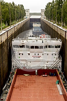 Vytegra, Russia - August 16, 2015: Two cargo ships entered the White Sea-Baltic Canal Gateway