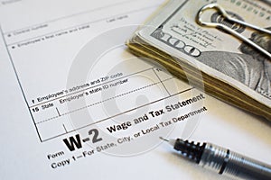 W-2 Tax Form With Fine Point Pen And Money Close Up High Quality