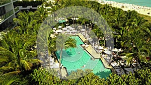 W Hotel pool deck with people swimming Miami Beach FL USA