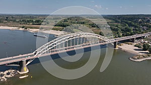 The Waalbrug is an arch bridge over the Waal that connects the center of Nijmegen with Lent. Roads N325 and S100 city