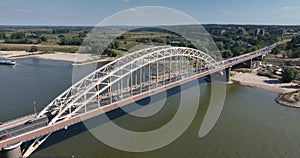 The Waalbrug is an arch bridge over the Waal that connects the center of Nijmegen with Lent. Roads N325 and S100 city