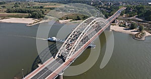 The Waalbrug is an arch bridge over the Waal that connects the center of Nijmegen with Lent. Roads N325 and S100 city