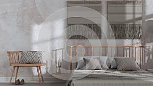 Wabi sabi bedroom in white and beige tones close up with macrame wall art and wallpaper. Wooden furniture, carpets and double bed