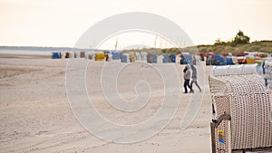 Wadden Sea Coast.Walks and rest on the Wadden Sea.Beach wicker boxes set on white sand.Fer Island.North Sea. recreation