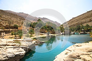 Emerald pools in Wadi Bani Khalid, Oman photo