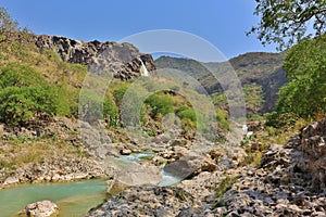 Wadi Dharbat lower Canyon with River and Waterfall photo