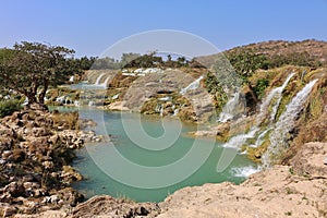 Wadi Dharbat rock pool with Waterfalls photo