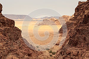 Wadi Rum desert panorama seen from canyon with dunes, mountains and sand, Jordan