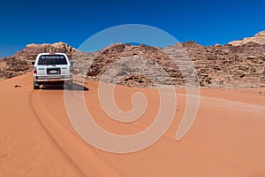 WADI RUM, JORDAN - MARCH 26, 2017: 4WD Toyota on a sand dune in Wadi Rum desert, Jord