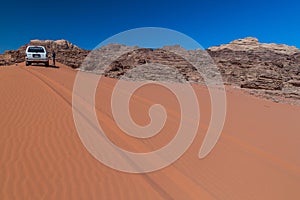 WADI RUM, JORDAN - MARCH 26, 2017: 4WD Toyota on a sand dune in Wadi Rum desert, Jord