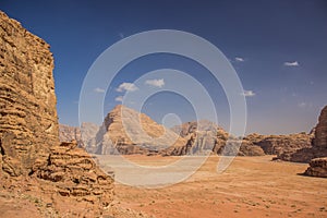 Wadi Rum Jordan Middle East desert scenery top view sand valley surrounded by dry rocky mountains picturesque landscape from above