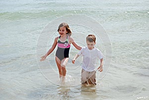 Wading in the ocean photo