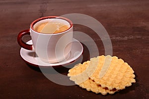 Wafel, caramel waffle and coffee cup, coffeebreak on dark background