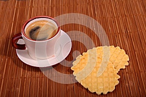 Wafel, caramel waffle and coffee cup, coffeebreak isolated on dark background