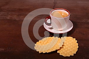 Wafel, caramel waffle and coffee cup, coffeebreak isolated on dark background