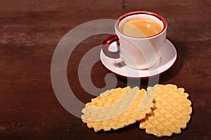 Wafel, caramel waffle and coffee cup, coffeebreak isolated on dark background