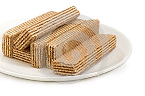 Wafer biscuits on a white dish closeup