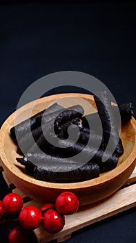 Wafer roll stick on a wooden bowl. food and drink concept. Christmas cake, Christmas and Newyear concept.