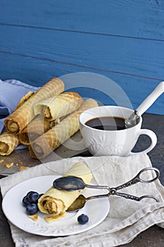 Wafer rolls with condensed milk on the tray