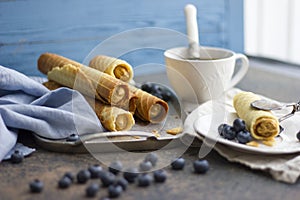 Wafer rolls with condensed milk on the tray