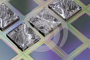 Pieces of polycrystalline silicon integrated on a polysilicon substrate with microchips photo