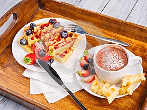 Wafers with fruits and berries on a close-up table