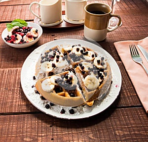 Waffel with some fruit and coffee