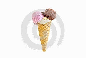 Three scoops of ice cream in a waffle cone isolated on white background