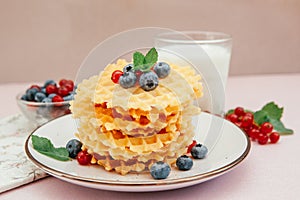 Waffle with blueberry berry and glass of milk, sweet dessert still life