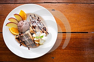 Waffle with chocolate icecream and fresh fruit. Sweet dessert.