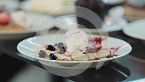 Waffle dish with delicious vanilla ice cream and fresh fruit