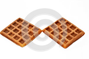 A waffle is a dish made from leavened batter or dough that is cooked between two plates that are patterned to give a