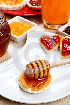 Waffle with honey and jam on a dish